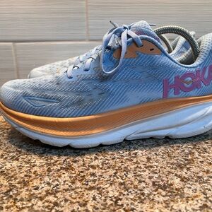 Hoka Women's Light Blue Running Shoe with Peach and Pink Accents